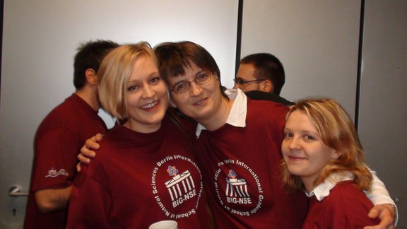 Three female BIG-NSE PhD students posing with the School T-shirt - Copyrights: J.P. Lonjaret 